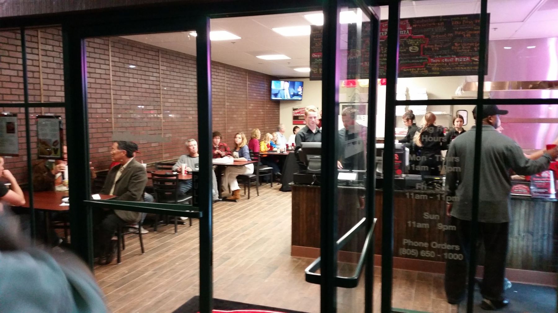Restaurant interior with brick walls and wood flooring