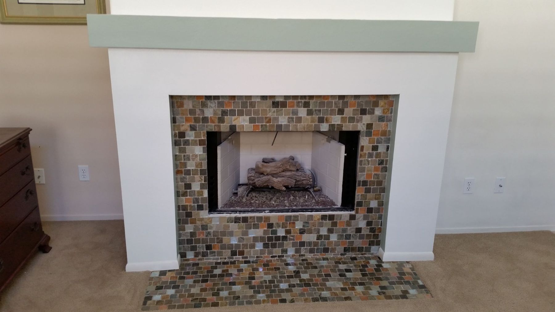 Fireplace with decorative tile surround