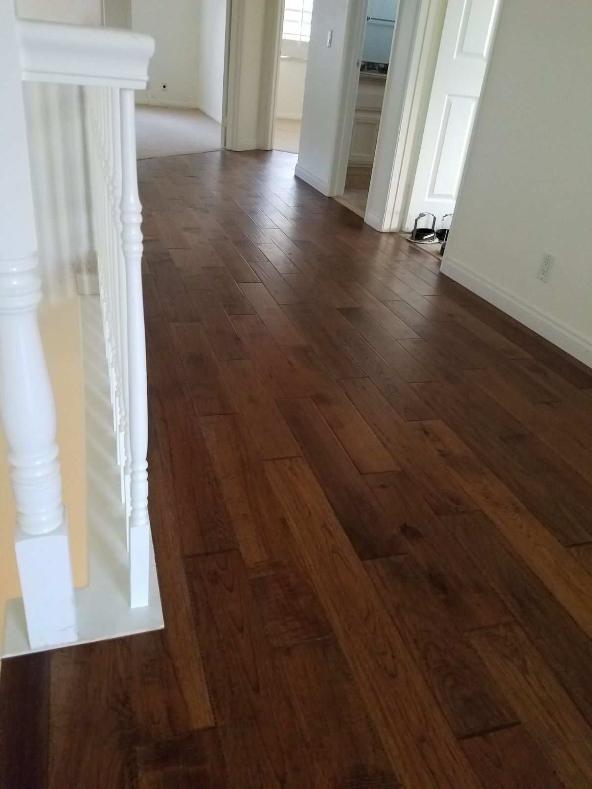 Newly installed hardwood flooring in hallway