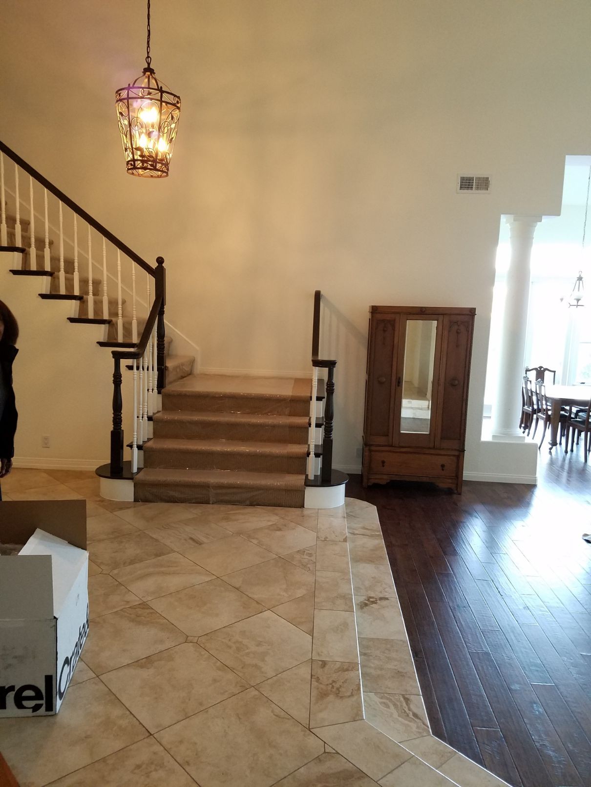 Entryway renovation with new tile and wood flooring