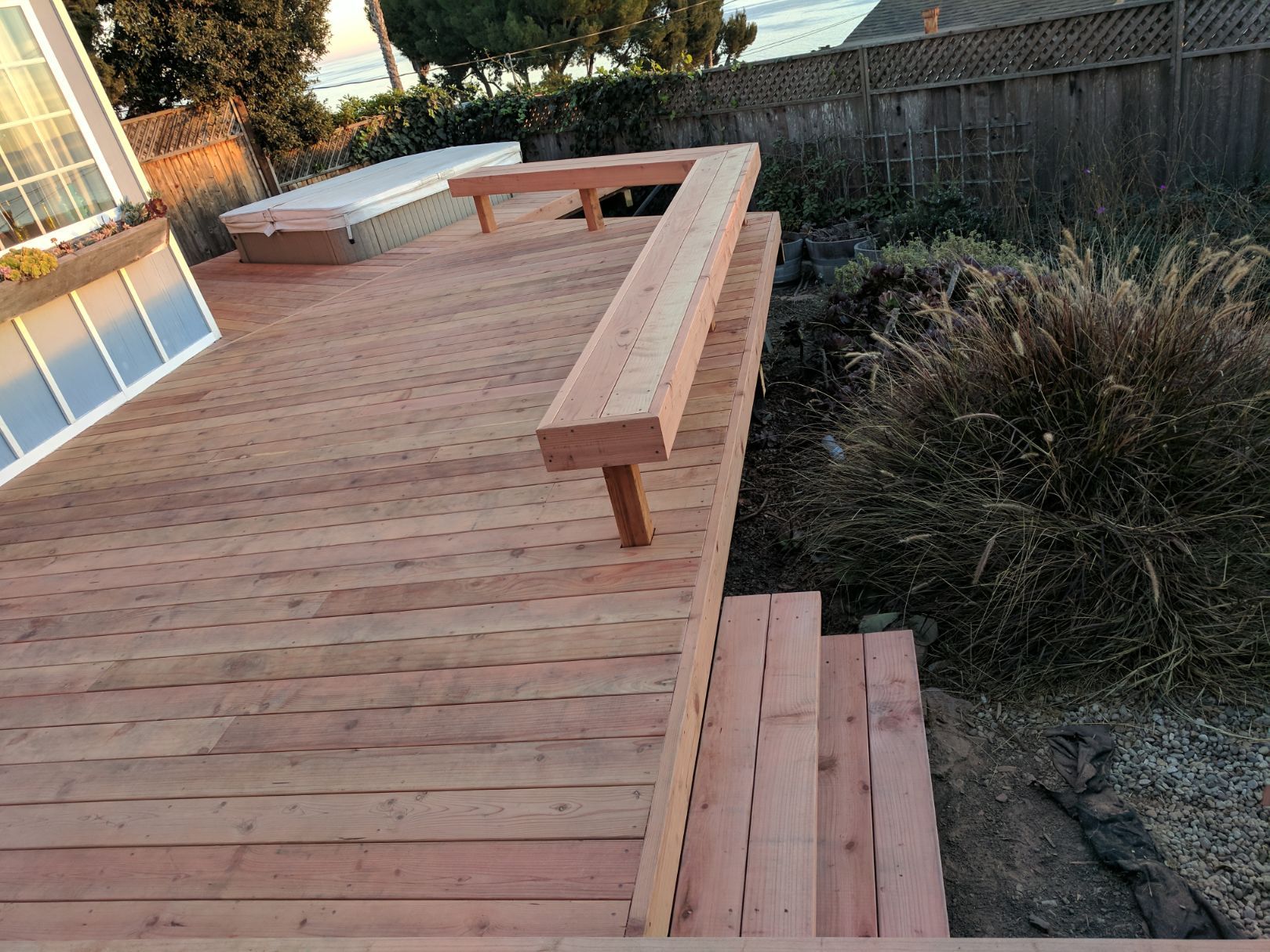 New wooden deck with built-in bench