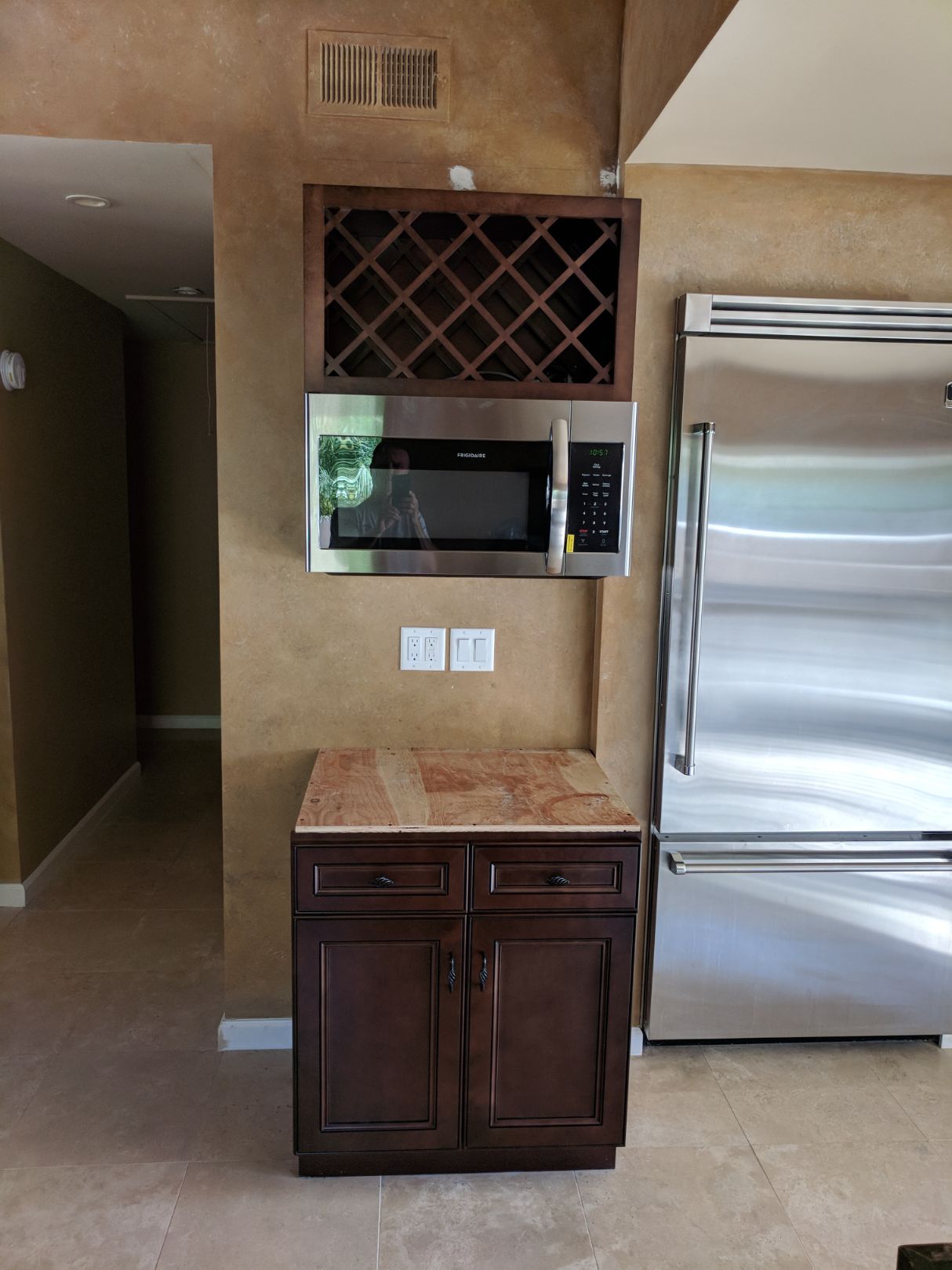 Kitchen cabinet, microwave, and wine rack installation